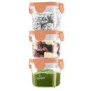 Stacked baby food containers from Quark, three 5 oz jars with orange lids, filled with various foods.