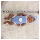 Reborn baby doll, African American vinyl, bald, wearing a blue outfit with a heart and a matching bow headband.