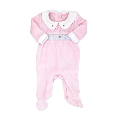 Pink velour coverall for baby girls featuring a white collar, floral smocking, and footed design.