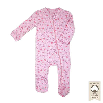 100% organic cotton sleeper in pink with heart patterns, featuring long sleeves and footed design, labeled as certified organic.