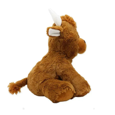 Soft plush sitting Highland cow toy with brown fur, small horns, and a tufted tail, designed for children.