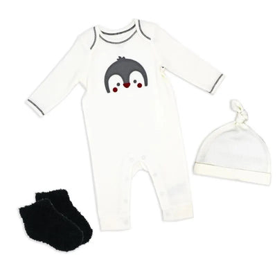 Neutral waffle coverall set featuring a penguin design, accompanied by a matching hat and black socks.