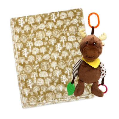 Plush tan moose activity toy with teething elements next to a patterned fleece blanket featuring tree designs.