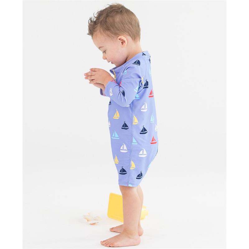 Rufflebutts long sleeve one-piece rash guard swimsuit for baby boys, featuring a sailboat pattern on a light blue background.