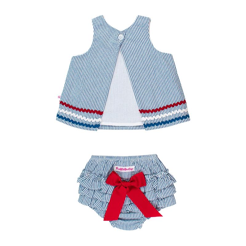 Blue seersucker swing top with red and white ric rac trim paired with ruffled bloomers featuring a red bow.