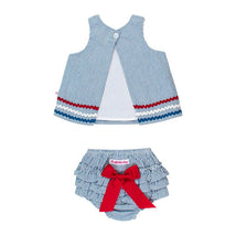 Blue seersucker swing top with red and white ric rac trim paired with ruffled bloomers featuring a red bow.