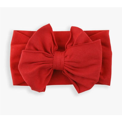 Red headband with a large bow, designed for girls, made of soft fabric. Ideal for stylish accessories.