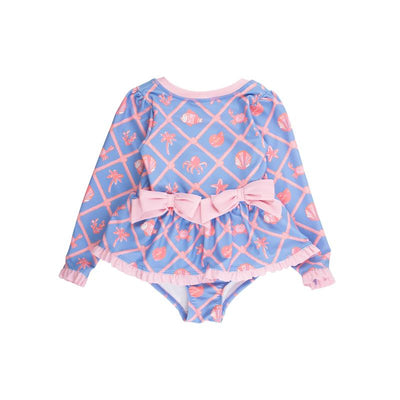 Long sleeve, peplum-style swimsuit for girls featuring a tropical print with pink accents and bows.