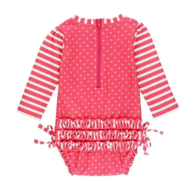 Hot pink long sleeve one-piece rash guard with white heart pattern and striped sleeves, featuring a ruffled bottom.