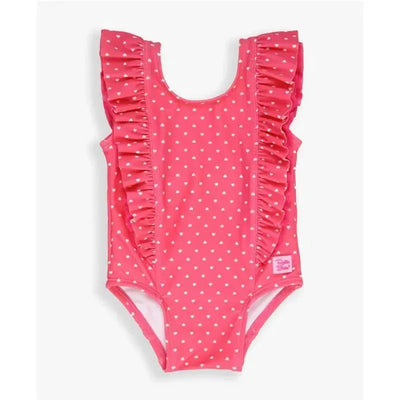 Hot pink one-piece swimsuit with white heart patterns and ruffle detailing along the shoulders, branded label visible.