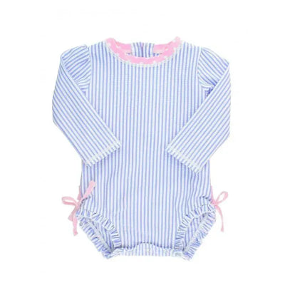 Periwinkle blue seersucker one-piece rash guard with long sleeves, pink trim, and side ties. Suitable for sun protection.
