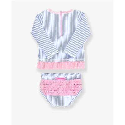 Periwinkle blue seersucker rash guard bikini by Rufflebutts featuring a long-sleeve top with pink polka dot trim and a matching ruffled bottom.