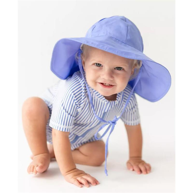 Periwinkle blue seersucker short sleeve one-piece rash guard on a smiling toddler wearing a matching sun hat.