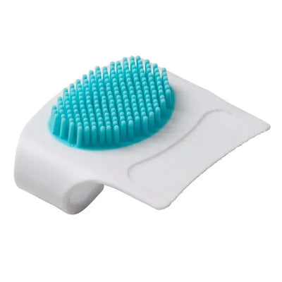 Cradle cap brush and comb set in white and blue, featuring a soft bristle head for gentle cleansing.