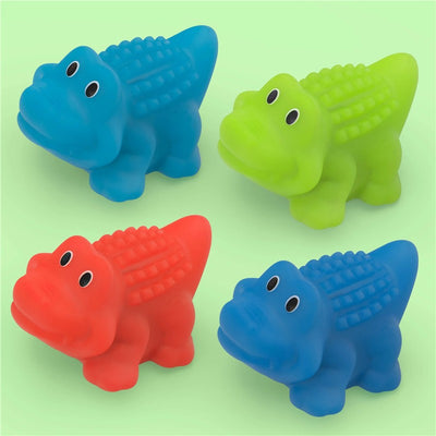 Colorful rubber gator bath toys in blue, green, and red, featuring smiling faces and textured backs, suitable for children.