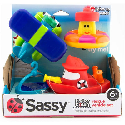 Brightly colored Sassy Harbor Town Rescue Set featuring a red boat, airplane, and float toy, designed for children 6 months and older.