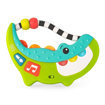 Sassy Rock-A-Dile musical toy featuring a smiling alligator design with colorful buttons and beads for interactive play.