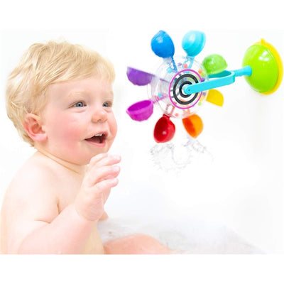 Baby enjoying the Sassy Whirling Waterfall Suction Toy, which features colorful cups spinning and splashing water.