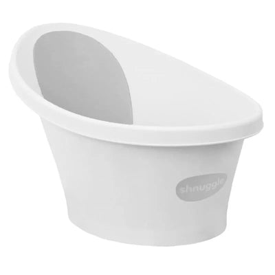 Newborn baby bath by Shnuggle, featuring a sleek white design with an ergonomic shape and plug for easy drainage.