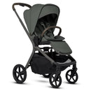 Silver Cross Breez Compact Stroller in pewter color with a folding bassinet, featuring a sleek design and adjustable seat.