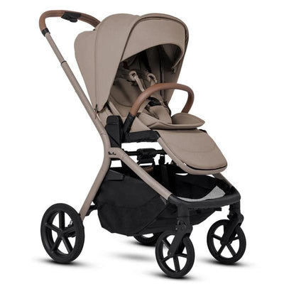 Silver Cross Breez modular stroller in Champagne color, featuring a large canopy, cushioned seat, and storage basket.