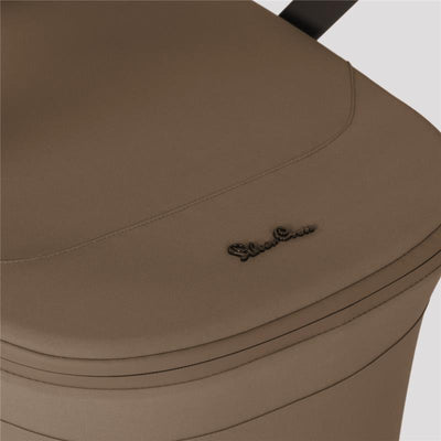 Silver Cross Breez bassinet in maple color, featuring a smooth fabric surface and logo detailing.