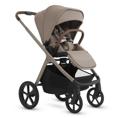 Full-size Silver Cross Cove 2 all-terrain stroller in champagne color, featuring a adjustable seat, large canopy, and storage basket.