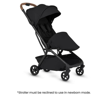 Silver Cross Nia compact stroller and bassinet bundle in black with a brown handle, suitable for newborn use.