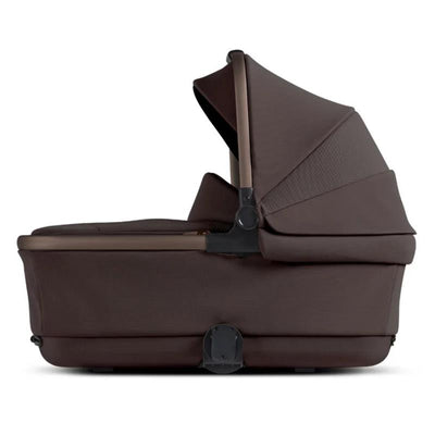 Silver Cross Reef 2 Folding Bassinet in Ganache color, featuring a sleek design with a folding canopy and sturdy base.