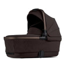 Silver Cross Reef 2 Folding Bassinet in Ganache, featuring a dark brown fabric with a sunshade hood and sleek design.