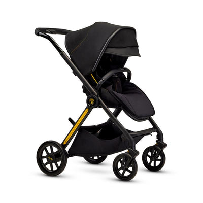 Silver Cross Reef AL Giallo stroller in black with yellow accents, featuring a reclining seat and large rear wheels.