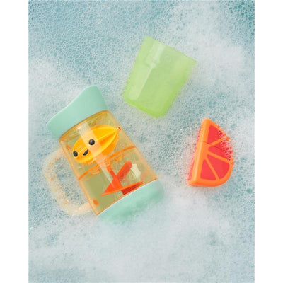 Skip Hop Baby Bath Toy Tub-to-Table Café set featuring a lemonade pitcher, cup, and orange wedge in bubbly water.