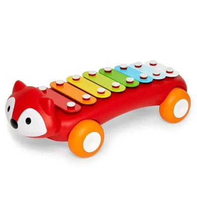 Colorful xylophone toy shaped like a fox, featuring eight musical bars in vibrant colors and rolling wheels.