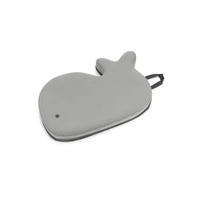 Grey whale-shaped bath kneeler with a textured surface and a side handle for easy storage.