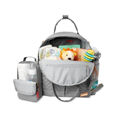 Skip Hop Suite Diaper Bag Backpack Set in dove color, featuring multiple compartments filled with diapers, toys, and baby essentials.