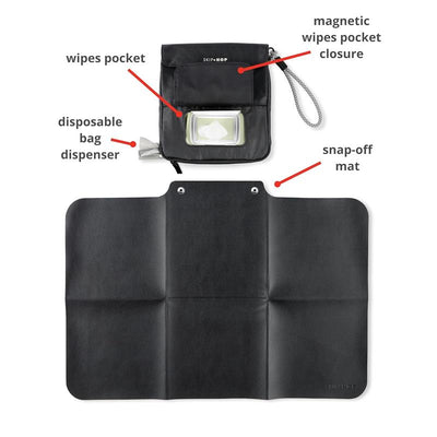 Skip Hop Travel Baby Changing Pad in Clean Slate Black with a snap-off mat, wipes pocket, and disposable bag dispenser.