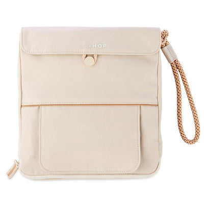 Travel baby changing pad in Clean Slate Oat color, featuring an easy-clean surface and a convenient wrist strap.
