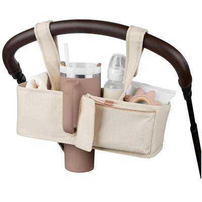 Skip Hop Ultimate Stroller Organizer in Oat, showcasing cup holder, compartments for baby bottles and essentials.