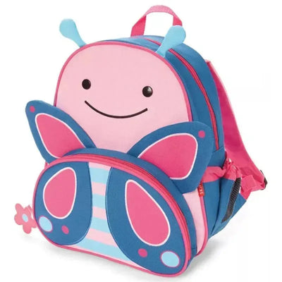 A colorful butterfly-shaped backpack featuring a smiling face, pink and blue fabric, and a flower zipper pull.