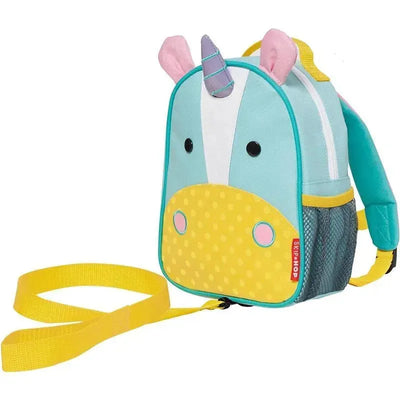 Skip Hop Zoo Mini Backpack in unicorn design, featuring a smiling face, horn, and yellow accents, ideal for children.