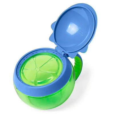 Bright green Dino-themed snack cup with a blue lid, designed for children, featuring segmented openings for easy snacking.