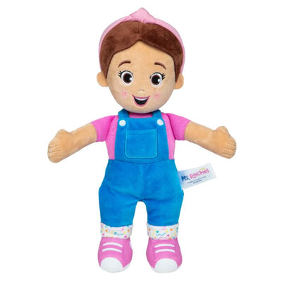 Spin Master Ms. Rachel Cuddlencomfort Doll with brown hair, pink shirt, blue overalls, and pink shoes, smiling cheerfully.