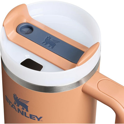 Stanley The Quencher H2.0 FlowState™ Tumbler 30 oz in Toast color with a gray lid and handle, featuring the brand logo.