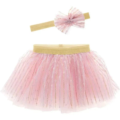Rose pink tutu with gold elastic waistband and matching headband featuring a decorative bow.