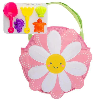 Pink flower-shaped tote bag with a yellow smiling face and a set of colorful sand toys, including shovels and molds.