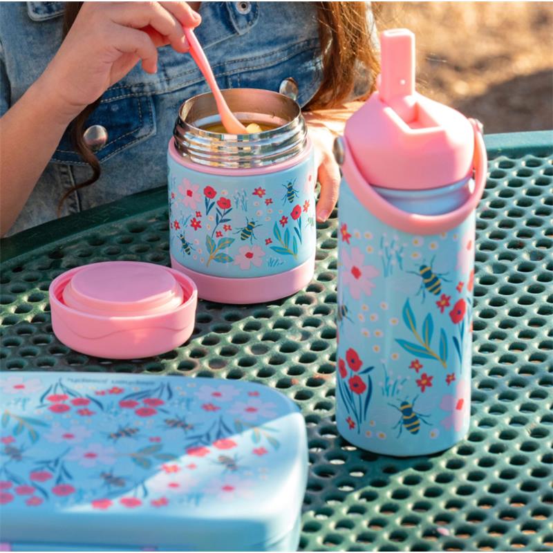 Insulated stainless steel bottle with handle and floral design, alongside a matching food container, on a green table.
