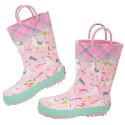 Waterproof pink rainboots for kids featuring unicorns, rainbows, and flowers with a green sole and plaid trim.