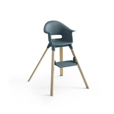 High chair in Fjord Blue with wooden legs and a footrest, designed for infants and toddlers.