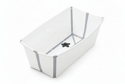 Folding baby bathtub in white and grey with a star-shaped drain and newborn support features.