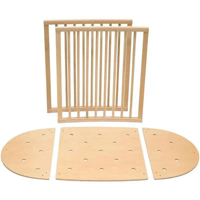 Stokke Sleepi Bed Extension components in natural wood finish, including curved and rectangular panels and slats.